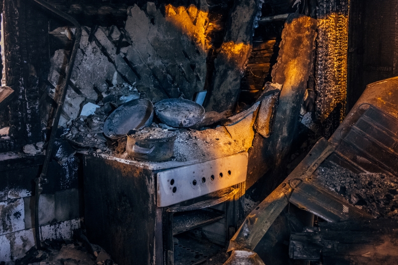 Burnt kitchen interior during appliance fire investigation